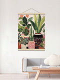 Indoor jungle hanging poster displayed above a minimalist white sofa