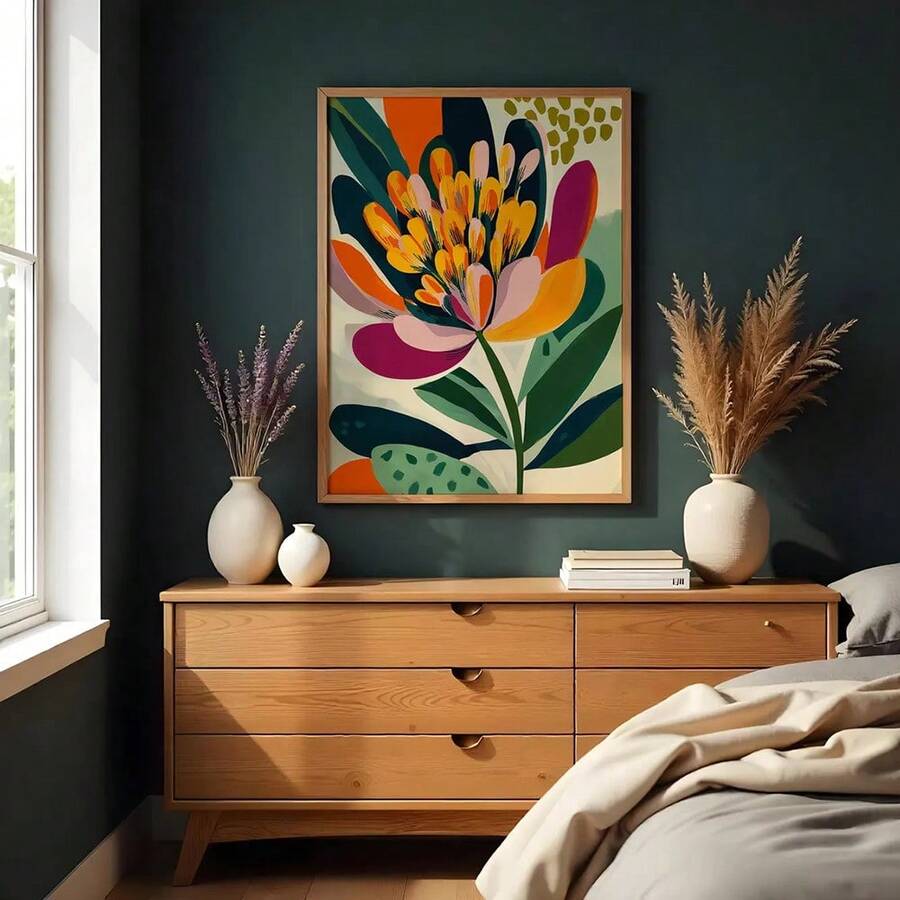 Medieval-inspired floral wall art in a wood frame above a bedroom dresser