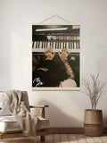 Earthrise space poster displayed in a wood frame on a pale wall