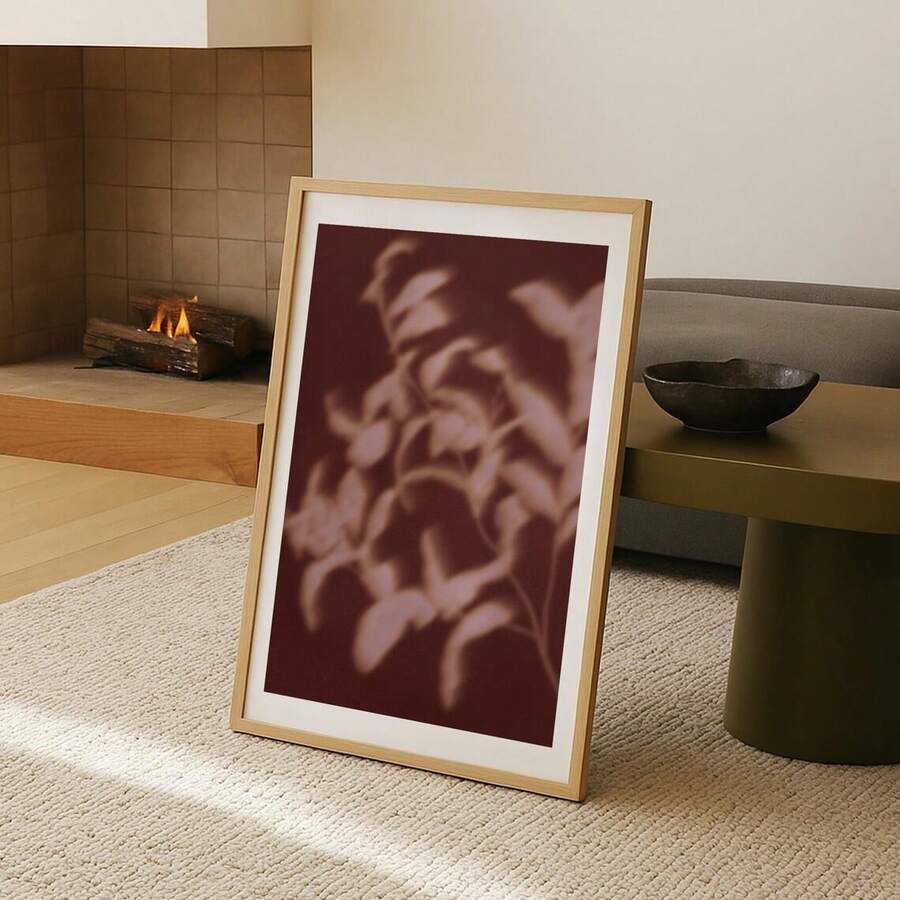 Minimal pink and beige leaf poster displayed as floor-leaning wall art