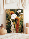Framed boho floral print styled with candles wood vase and neutral textiles