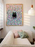 Cute black cat flower print hanging above cream sofa with pastel pillows