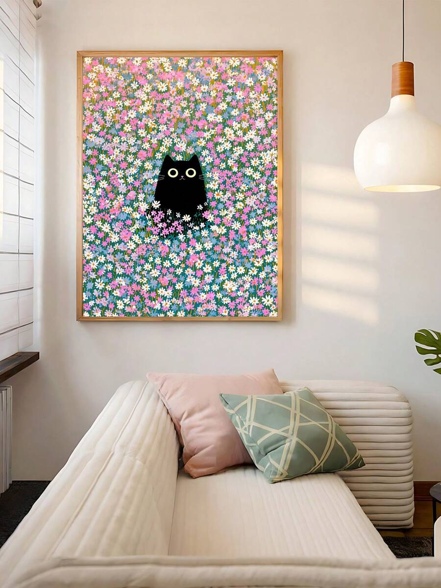 Cute black cat flower print hanging above cream sofa with pastel pillows