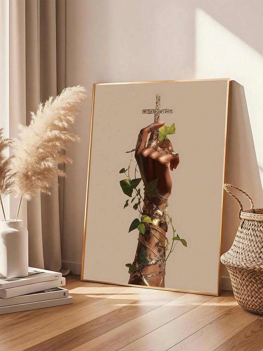 Framed cross and vine wall art beside pampas grass and books
