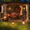 Solar pendant lantern charging by day and glowing at night in garden scene.