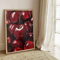 Red fruit wall art with deep burgundy tones and bold painterly texture