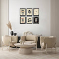 Six black framed casino art prints arranged above modern lounge seating