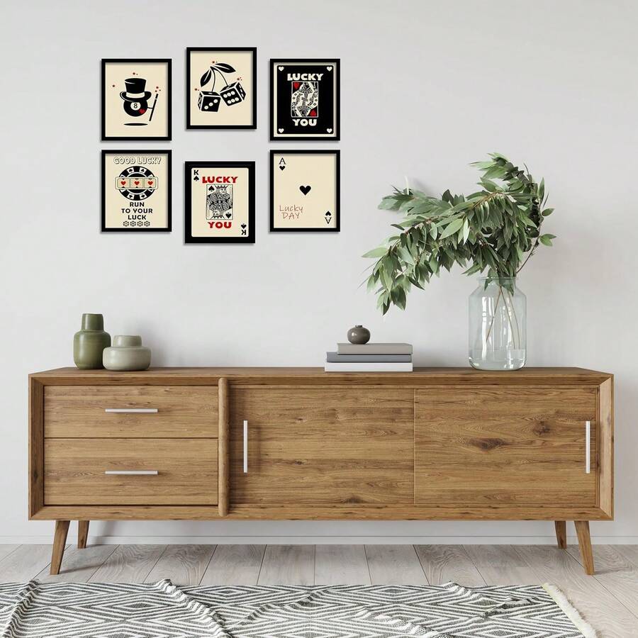 Lucky card themed wall art set displayed above a wooden sideboard