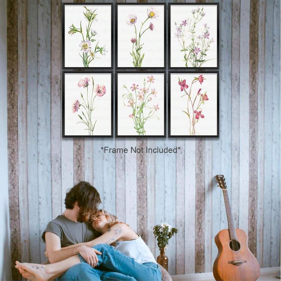 Six vintage botanical flower prints in a grid on a textured wall
