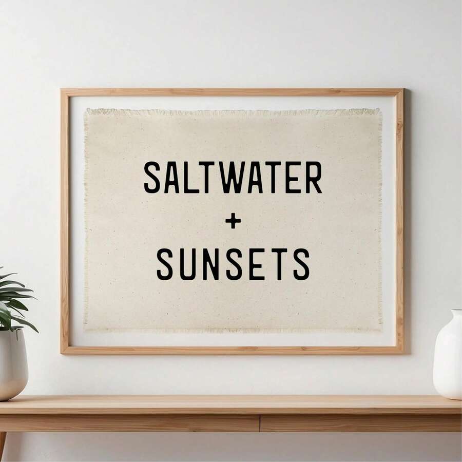 Framed coastal canvas wall art with Saltwater and Sunsets text on cream textured background