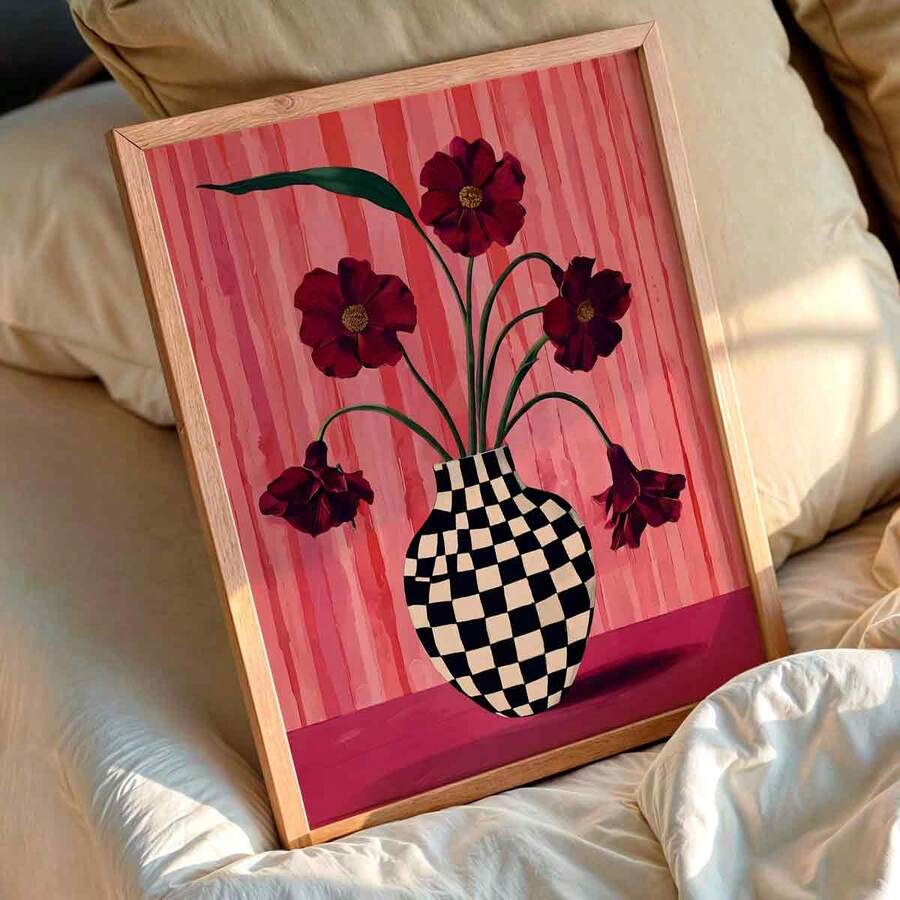 Floral checkered vase canvas print in a wood frame above cream bedroom bedding