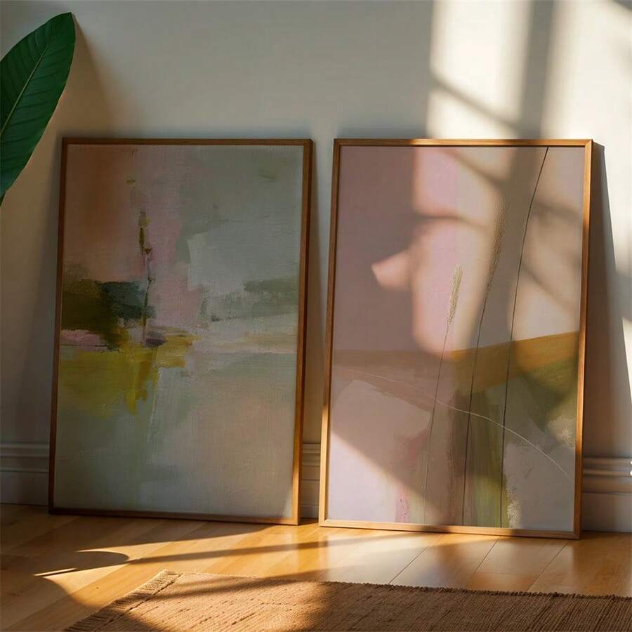 Pastel abstract wall art in slim natural wood frames for a bright living room