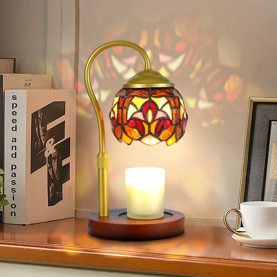 Stained-glass candle warmer lamp with gold arm and wood base warming white candle