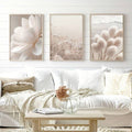 Minimalist floral canvas set styled above a white sofa