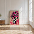 Graphic pink eyes and checkered vase canvas print styled as a floor-leaning wall art piece
