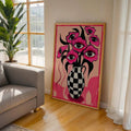 Surreal floral checkered vase wall art in a wood frame in a creative interior