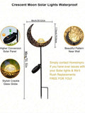 Warm glowing crackle globe moon pathway decor beside landscaped yard.