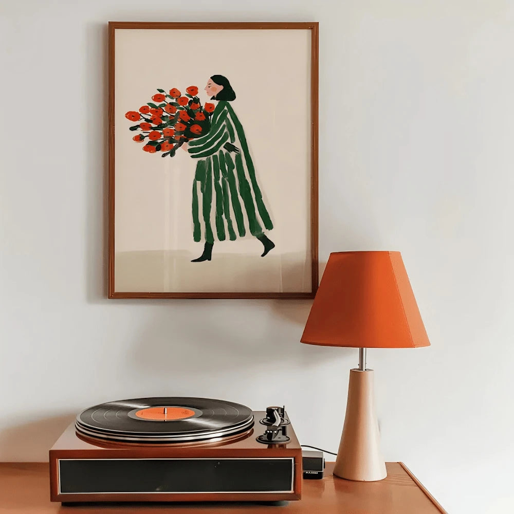 Framed minimalist woman carrying bouquet of red flowers, leaning on wall beside stack of books