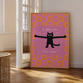 Black cat typography canvas art in a warm neutral living space