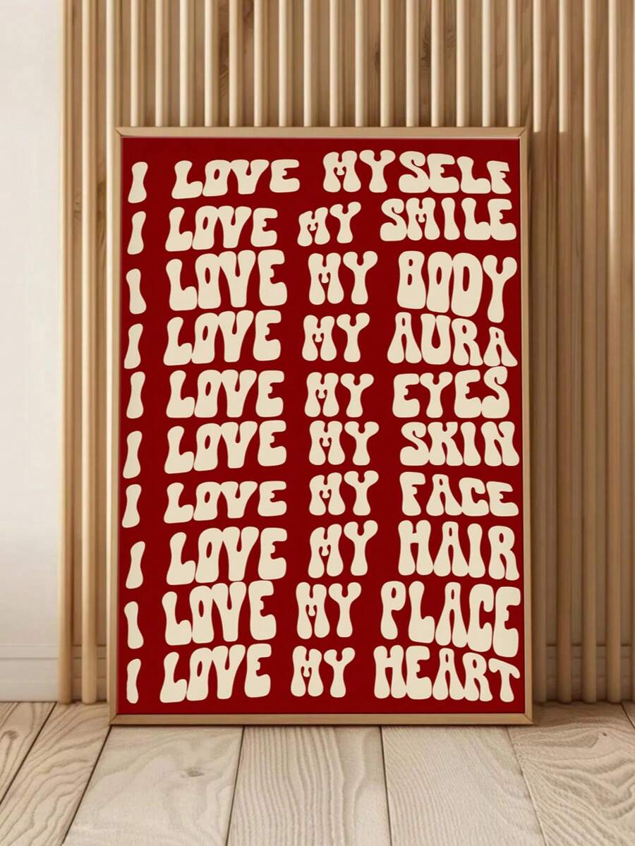 Close view of red self love affirmation poster leaning against wood slat wall
