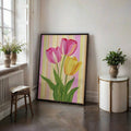 Pastel tulip canvas artwork in a black frame near a bright window