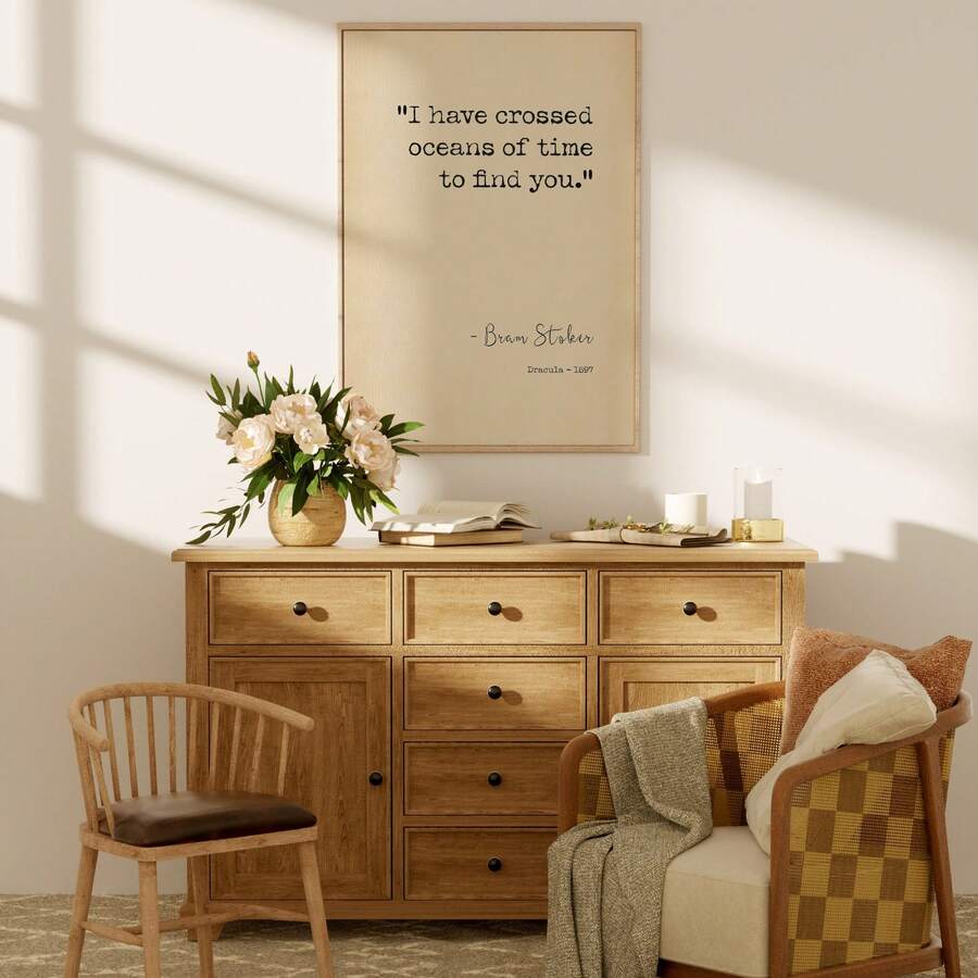 Dracula oceans of time poster hanging above wooden dresser in cozy room