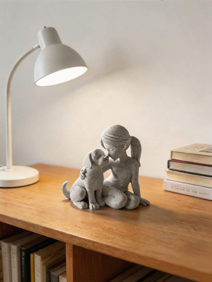Nordic girl and dog sculpture in speckled off-white stone-look finish.