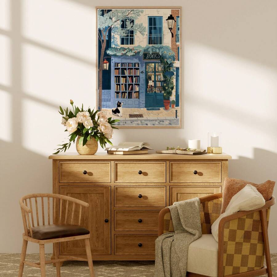 Cozy bookstore dog wall art above wooden dresser near chair and reading nook