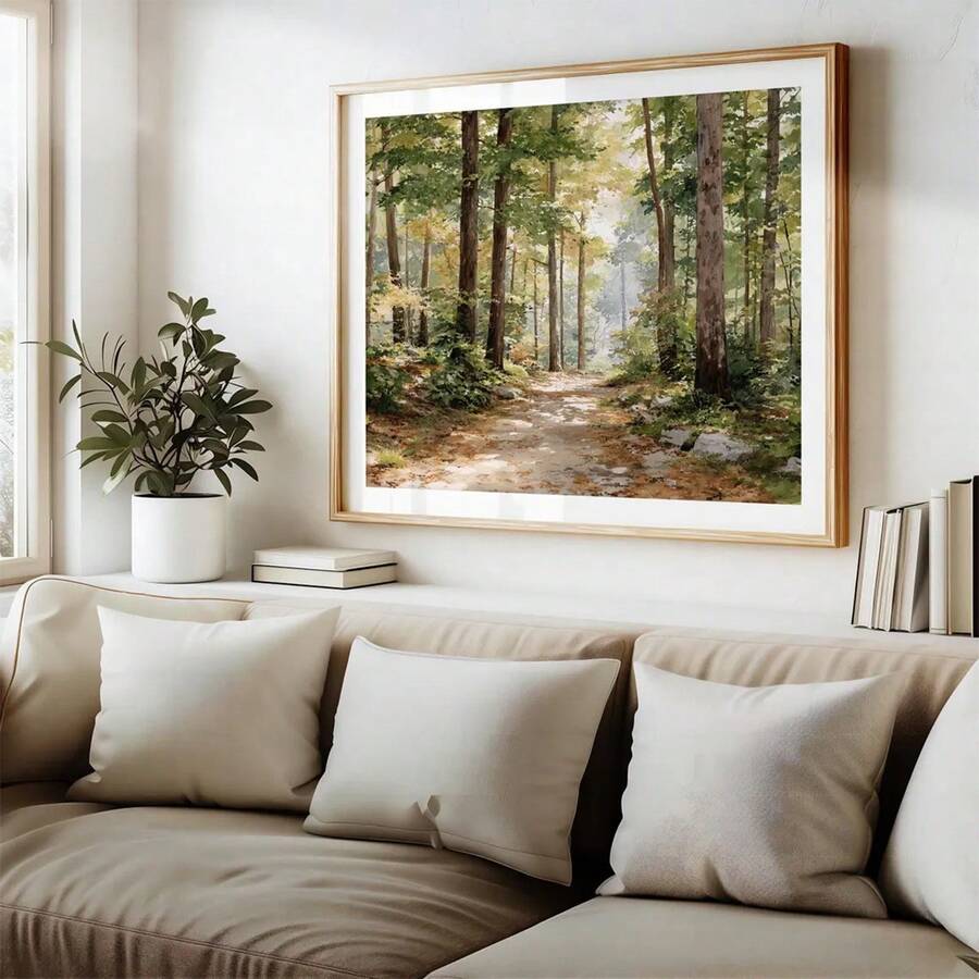 front framed view of Framed canvas-style forest landscape wall art showing a sunlit woodland trail with green foliage, tall trees, soft gold light and rustic cottage mood.