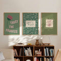 Styled display of inspirational floral wall decor for a calm home office