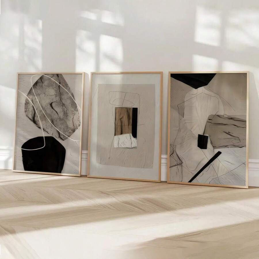 Three piece neutral abstract wall art set with beige black shapes and wood frames