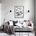 Black and white dancefloor poster above sofa with guitar nearby