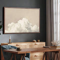 Neutral wall decor on dark wall with soft cloud landscape print above cabinet desk area