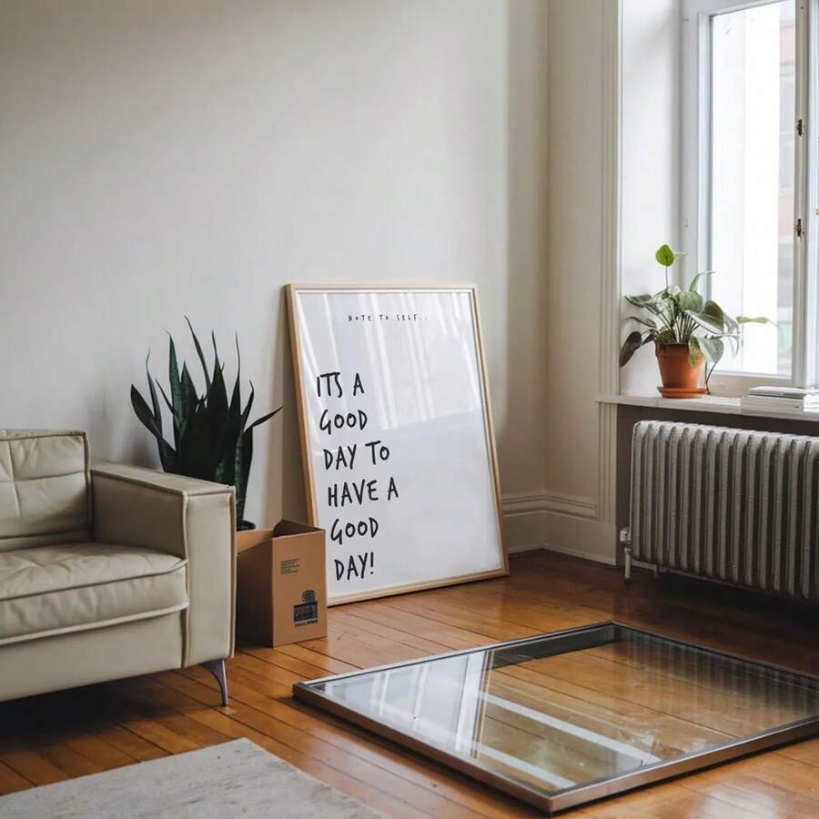 Good day motivational poster leaning near sofa and window in modern room