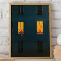 Framed window wall art showing dark building facade with glowing golden windows