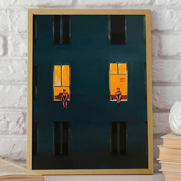 Framed window wall art showing dark building facade with glowing golden windows