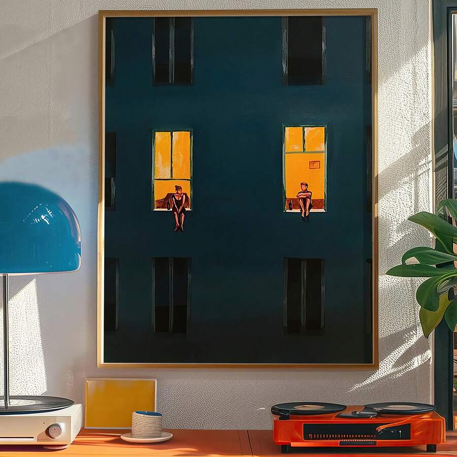 Framed window wall art showing dark building facade with glowing golden windows