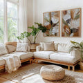 Two-piece earth tone floral wall art displayed in sunlit boho bedroom
