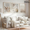 Beige foxtail and wildflower print set styled above a white sofa