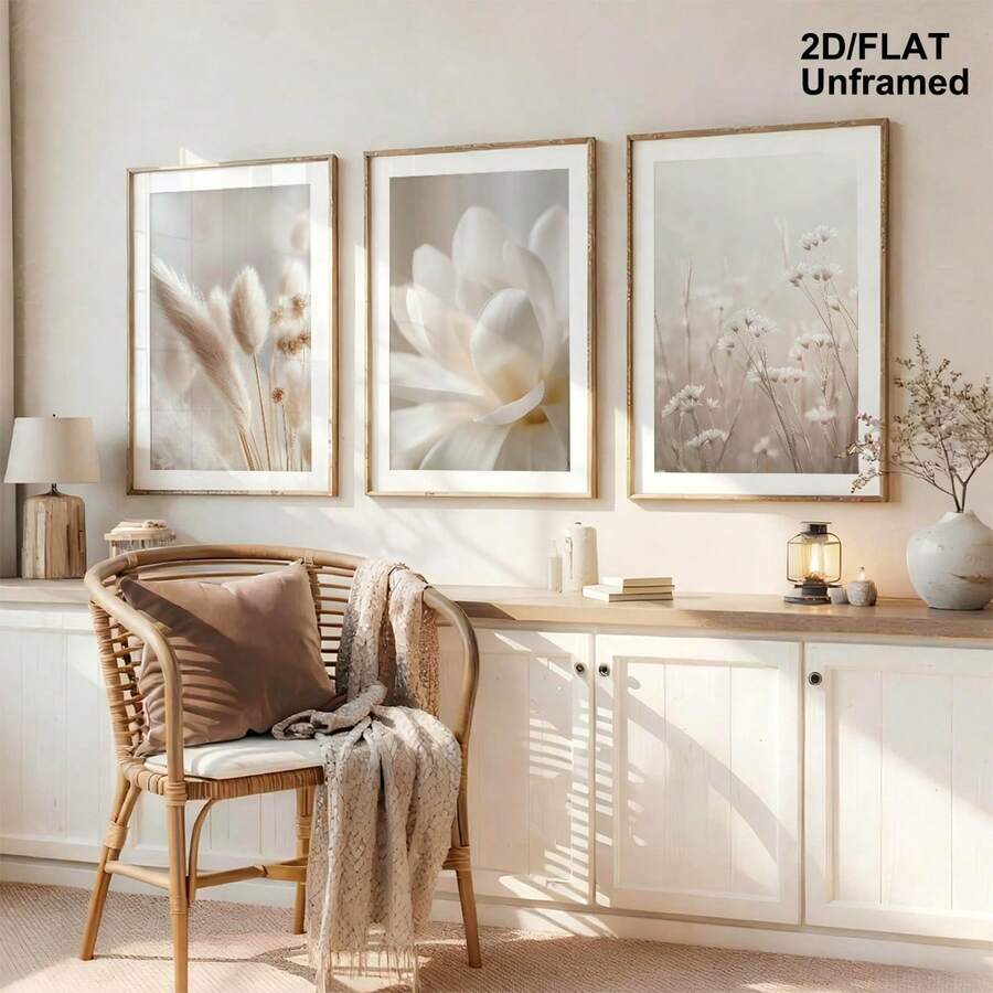 Three soft floral posters above a cabinet in a sunlit neutral room