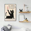 Large black cat quote poster on white wall shelves