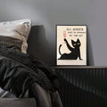 Funny cat poster on bedroom cabinet beside bed