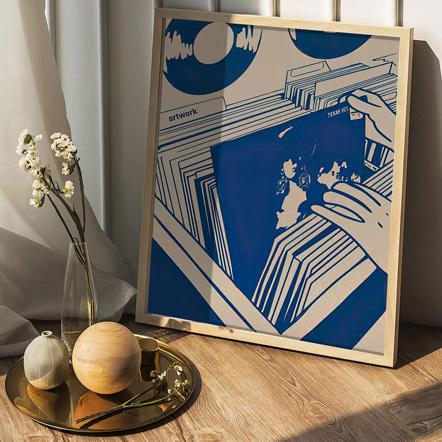 Framed blue music map poster leaning on wood floor