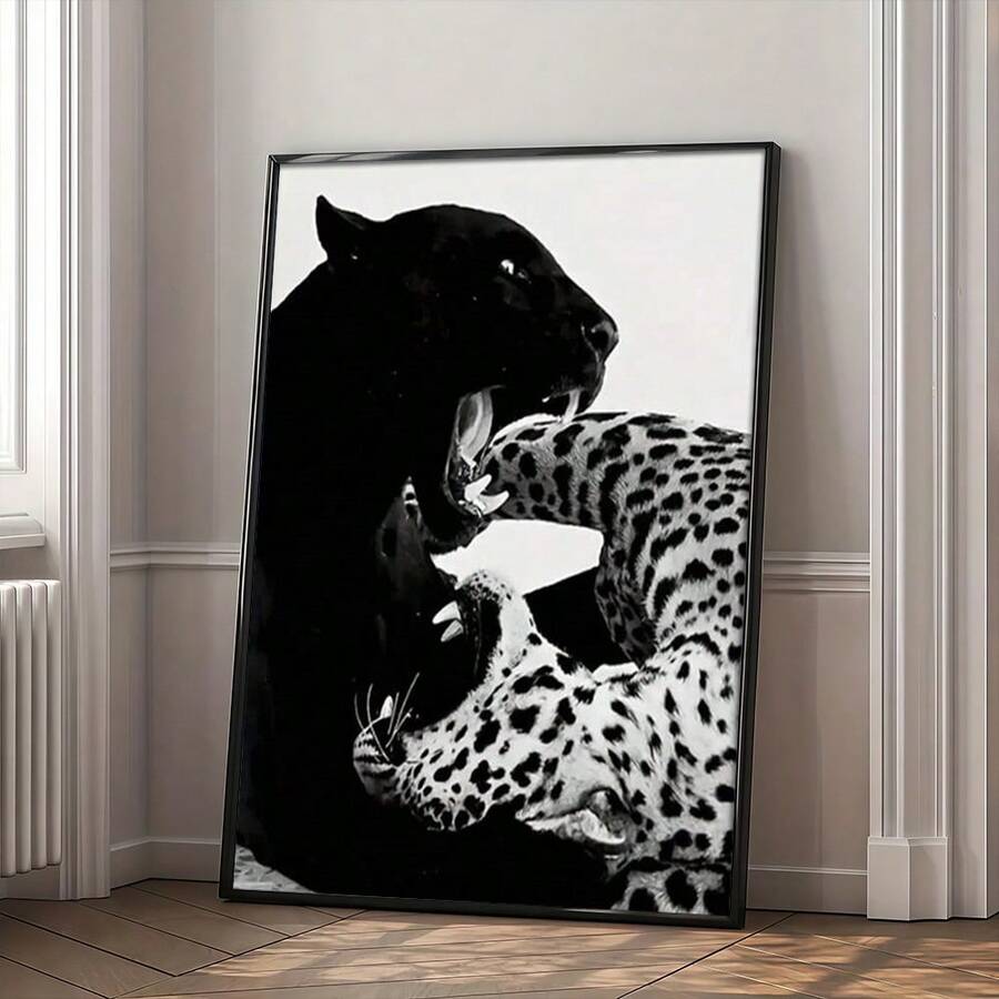 Black panther and spotted leopards wall art above light wood desk