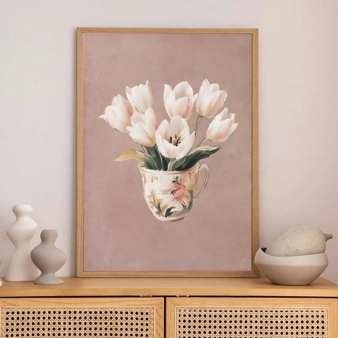 Soft pink floral wall art with white tulips arranged in vintage teacup
