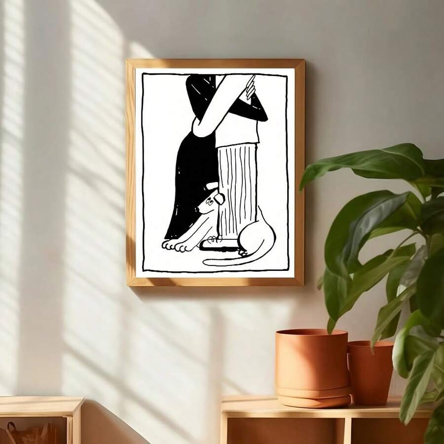 Black-and-white embracing couple and cat line art shown above a styled console