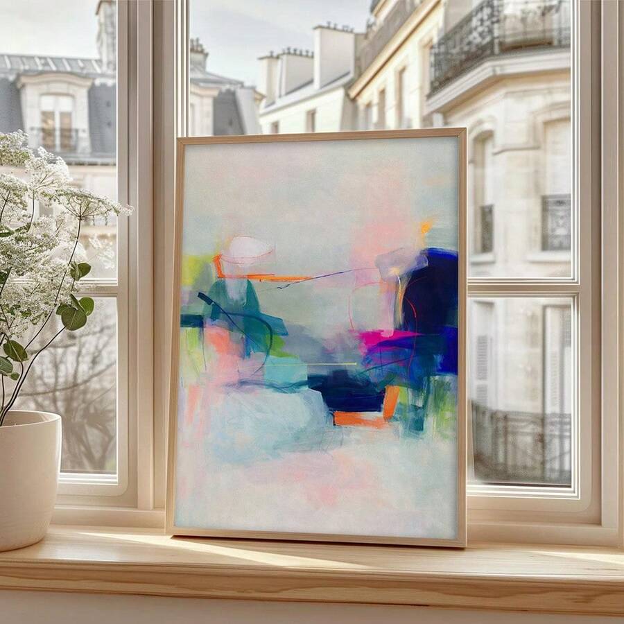 Pastel abstract framed wall art above cream sofa in bright living room