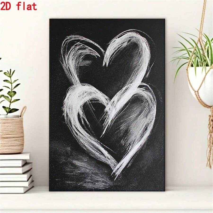 Black canvas with overlapping white chalk hearts beside books and plants
