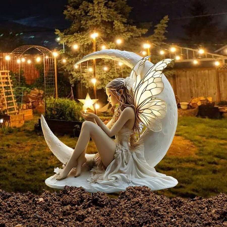 Glow in the dark fairy garden stake with illuminated wings, moon, and star.
