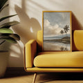 Vintage tropical palm lagoon wall art displayed above a mustard sofa